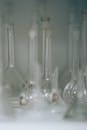 A collection of laboratory glassware in soft focus, ideal for scientific themes.